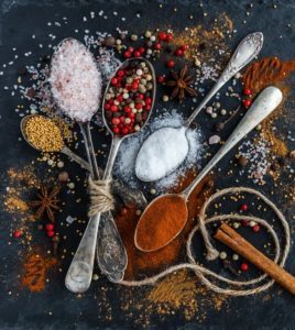 photo of spoons overflowing with spices