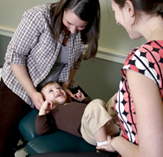 photo of two women with a small child between them