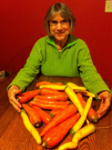 photo of woman with a lot of carrots